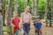 Friends on the ropes course. Young people in safety equipment are obstacles on the road rope Portrait of a disgruntled