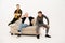 Friends seated on couch in studio. Three stylish young guys talking on the camera. Group of friends are sitting on a