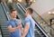 Friends shaking hands in a shopping mall