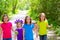 Friends and sister girls walking outdoor in forest track