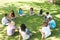 Friends sitting in a circle at park