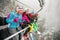 Friends skiers and snowboarders on ski lift for skiing in the mo