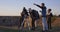 Friends stargazing together using a professional telescope