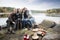 Friends Taking Self Portrait At Lakeside Camping