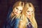 Friends, twin sisters with blond hair