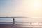 Friends walking in the sea beach, lonely summer season