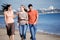 Friends walking together at the beach