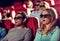 Friends watching horror movie in 3d theater
