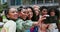 Friends, women and happy in selfie outdoor, influencer group and memory in city for social media post. Young, smile in
