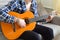 Friendship bracelets with Indian pattern on the guitarist`s wrist