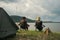 Friendship fisherman or Angler sitting a chair together and camping to fishing at the lake