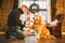 Friendship of man and dog. Pet golden retriever breed labrador shaggy dog. A man trains, teaches a dog to give a paw, to execute c