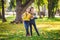 Friendship between siblings. Siblings together outside with bright colored background. Kids autumn portrait. Brother and sister