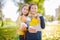 Friendship between siblings. Siblings together outside with bright colored background. Kids autumn portrait. Brother and sister