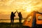 Friendship of young women resting camp near mountain