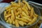 Fries potato chips cooking in basket