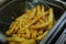 Fries potato chips cooking in basket