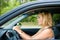 Fright face of woman sitting in car