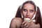 Frightened brunette woman enjoying flavorous dessert with cream.