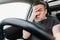 frightened man with closed eyes drives car on highway.dangerous accident on road