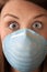 Frightened Woman with Surgical Mask