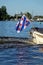 Frisian flag on sloop boat on lake near Grou in Friesland, the Netherlands
