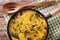 Fritatta with spinach, cheddar cheese and mushrooms in a frying