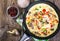 Frittata with mushrooms and peppers in frying pan