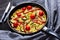 Frittata, omelet with sausages, veggies, top view