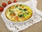 Frittata with rice, carrots, broccoli and tomatoes