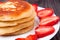 Fritters on a plate with strawberries wooden background