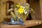 Frog figurine and flowers in a watering can, Provence style, Interior design