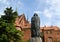 FROMBORK, POLAND. A monument to the scientist Niicolaus Copernicus against the background of a cathedral complex