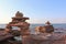 Front of 2 Piles of large rocks stacked on a sandy beach in Nova Scotia