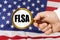 In front of the American flag, a man holds a magnifying glass in his hand with the inscription - FLSA