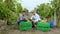 In front of the camera Afro American farmer and charismatic businessman with a digital tablet analyzing the grapes