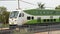 front car of green and white go train transit mass transportation system stopped