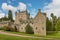 Front of Cawdor Castle with turret and drawbridge with bell and Stags Head Buckel Be Mindfull emblem. The castle has been known