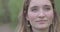 Front close up of caucasian woman, beautiful young human face with pale white skin and brown hair, serious looking next