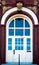 Front door brick building with arched windows doors with glass