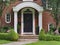 Front door with curved portico roof