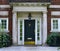 Front door with stone pillars