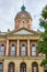 Front of Elkhart County courthouse on cloudy day with fluffy white clouds, summer, Indiana