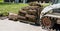 Front end loader and a pallet with rolls of sod grass for installation