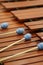 Front ensemble marimba with brown keys and blue yarn mallets