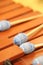 Front ensemble marimba with brown keys and blue yarn mallets close-up