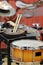 Front ensemble percussion rack orange snare drum and sticks