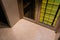 front entrance foyer hallway of a large home house with yellow walls and a wood door with windows and a large custom