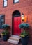 Front entry door of brick town home.