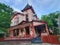 The front exterior of the red and pink color Victorian style house near Eureka Springs, Arkansas, U.S